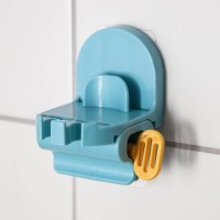 Держатель для зубных щёток с выдавливателем для пасты на липучке, 7×5,2×8 см, цвет МИКС